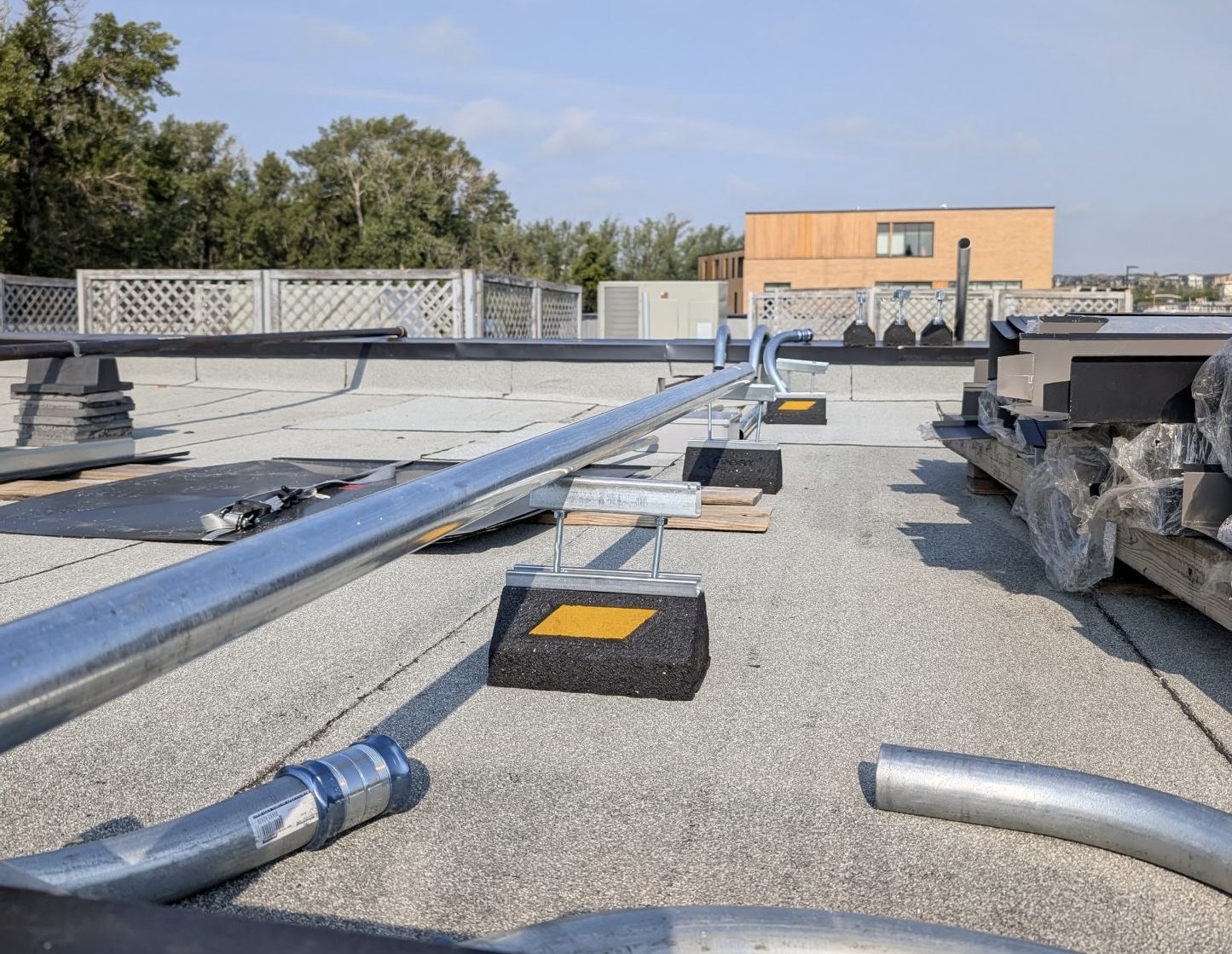 Rooftop mechanical and conduit installation on a commercial building